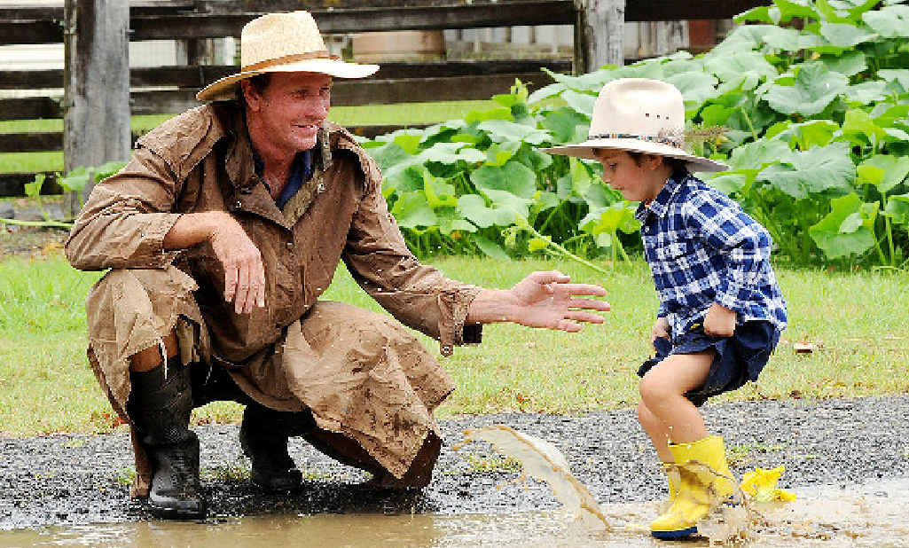 Not everyone gets sick of rain, including young Mason pictured with his dad, Craig Murray, of North Lismore, at Lismore Saleyards late last year. Not everyone gets sick of rain, including young Mason pictured with his dad, Craig Murray, of North Lismore, at Lismore Saleyards late last year.